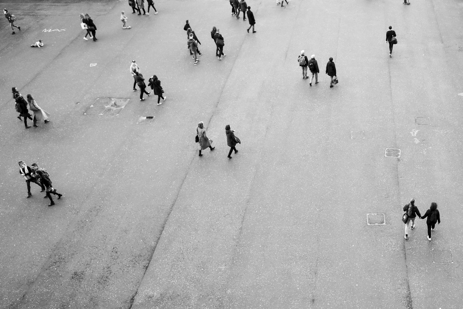 People crossing a public square, photographed from above